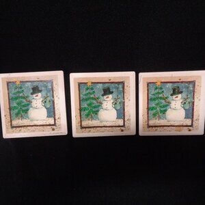 3 snowman coasters in absorbent stoneware dated 1997 possibly an early T Kogut